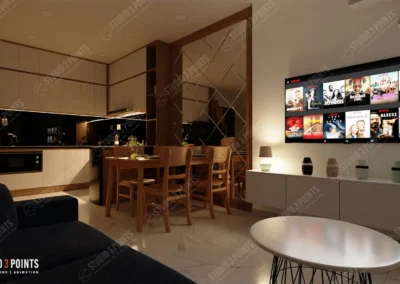 Espace de vie moderne en soirée avec une cuisine ouverte, une salle à manger en bois clair et un salon équipé d’un grand écran mural affichant une plateforme de streaming.